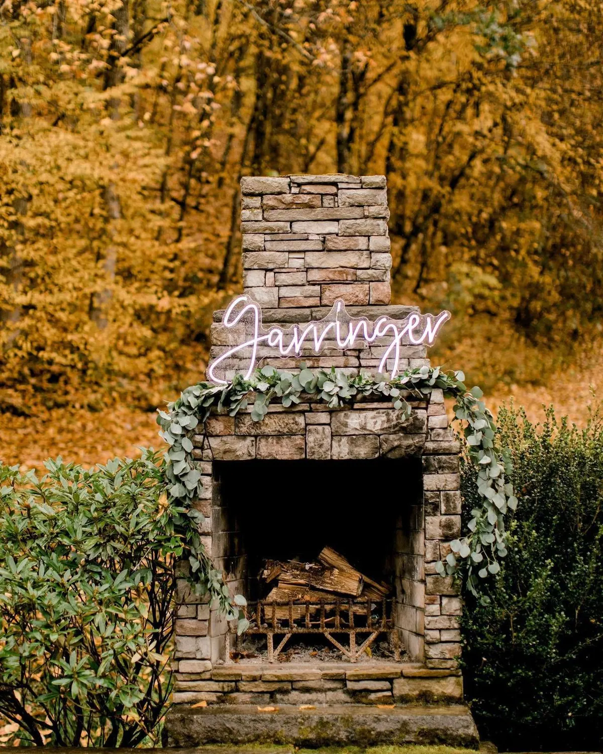 The stacked-stone fireplace in the courtyard